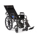 Medline Guardian Reclining Wheelchair shown in a full 180-degree recline position, with the padded headrest and elevating leg rests for maximum comfort.